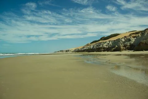 Desert beach with cliffs Stock Photos