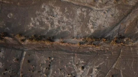 Desert Birds eye drone shot aerial salt lake in mountain foothill Stock Footage 263295199