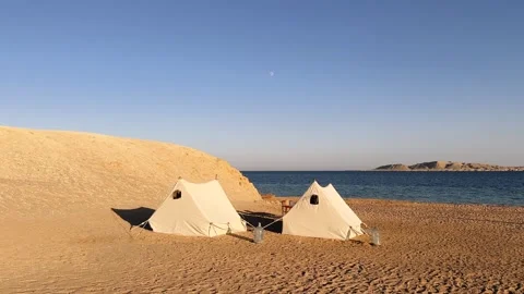 Desert Camping Tents on Sandy Beach of Red Sea and Island in Background in Ras Stock Footage 341909485