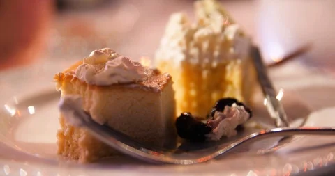 Desert cheesecake on a dinner table Stock Footage 95448312