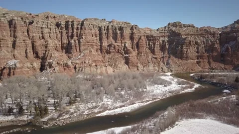Desert cliffs along small river in winter Stock Footage 166127599