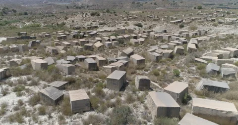 Desert covered by stone blocks from old quarry from above Stock Footage 210232781