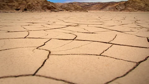 Desert - Cracked Ground in the Rippling Heat Slider Shot Stock Footage 137281653