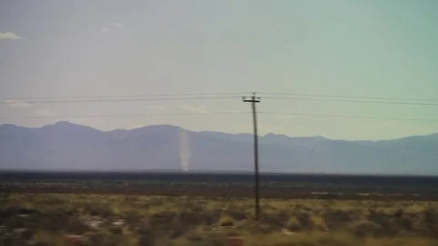 Desert Drive with dust devil in distance Stock Footage 82506601