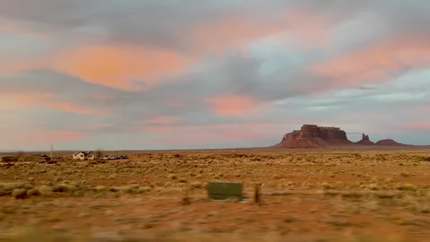 Desert Drive Through Monument Valley at Pink Sunset 動画素材 309048301