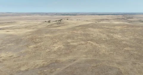 Desert Dry Prairie and Small Hills Drone Aerial View Browning Montana USA Video stock 335795474