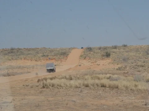 DESERT DUNE 2 4WDS GOING OVER Stock Footage 100415184