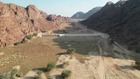 Desert Engineering: Water Management Structure in a Wide Arabian Valley Stock Footage 320823127