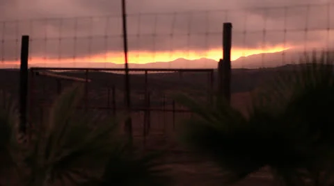 Desert Farm with Distant Mountains at Sunset HD Video 스톡 동영상 24814822
