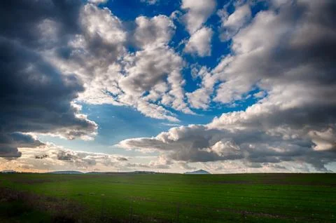 Desert field under a dramatic sky Stock Photos