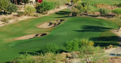 Desert Golf Course Putting Green Aerial Drone Bunkers Pin Flag Trees Manicured Stock Footage 334537843