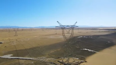 Desert High Voltage Power Lines and Transmission Towers 4K Aerial Stock Footage 319615735