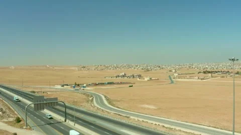 Desert highway with expanding rural development Amman-Jordan 2/5/2023 Stock Footage 297236702