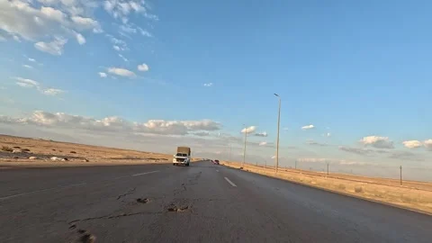 Desert highway exploration across Cairo Fayoum Desert Road open road views Stock Footage 330081661