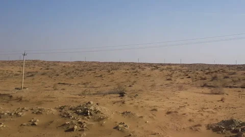 Desert Landscape and Power Lines in Countryside of Uzbekistan, Passenger Stock Footage 248219576
