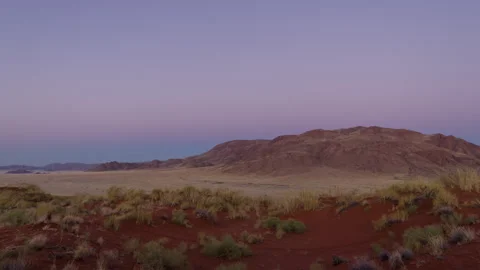 Desert Landscape at Dusk with Mountain Range Stock Footage 303506737