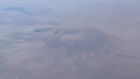 Desert Landscape High Altitude View From a Passenger Plane Stock Footage 277321753