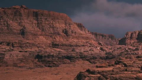 Desert landscape with rock formations and cloudy sky during daytime Stock Footage 345064501
