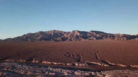 Desert with large mountain in background panning shot Stock Footage 81574999