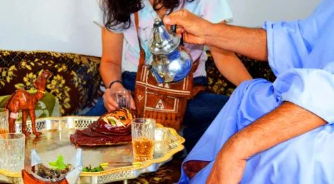 Desert man serving tea Stock Photos