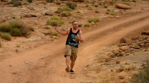 Desert Mountain Biking Dancing Man Bounding Down Trail Stock Footage 25207358