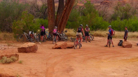 Desert Mountain Biking Riders Arrive at Camp Stock Footage 25211595