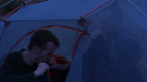 Desert Mountain Biking Riders Inflating Sleeping Mat in Camp Stock Footage 25208629