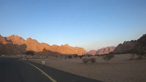 Desert Mountain Road with Arabic Slow Sign Vídeos de archivo 337376945