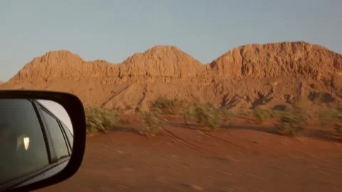 Desert mountains seen from car window during road trip, travel Video stock 329237867