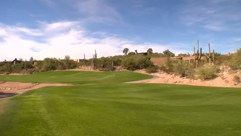 Desert mountains surround golf course Arizona New Mexico California Video stock 125277713