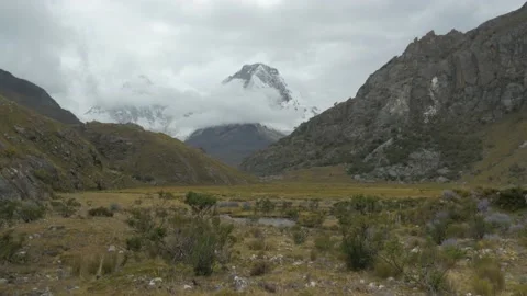 Desert plain with a mountain in the clouds, on the Andes mountain range, in Peru Stock Footage 237172566