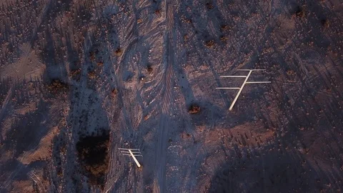 Desert power lines flyover dirt road Stock Footage 81575019