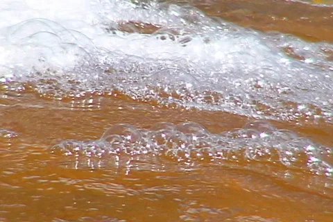 Desert River foaming bubbles Stock Footage 655450