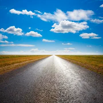 Desert road and dramatic sky Stock Photos