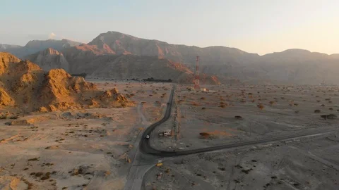 Desert road surrounded by sandstone rocks aerial viewDesert road surrounded b Stock Footage 103206784