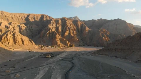 Desert road surrounded by sandstone rocks aerial view Stock Footage 103207705