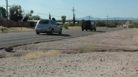 Desert Road with Traffic Stock Footage 12177187