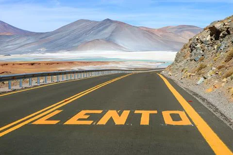 Desert Road with the Word LENTO Means SLOW in Spanish Stock Photos