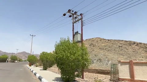 Desert Roadside View of Rugged Mountains and Utility Poles Video stock 334787251