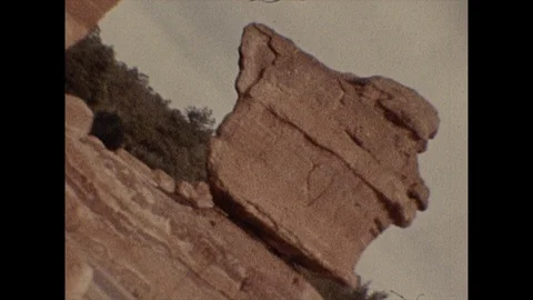 Desert rock formation with crazy side-to-side tilts Stock Footage 129840465