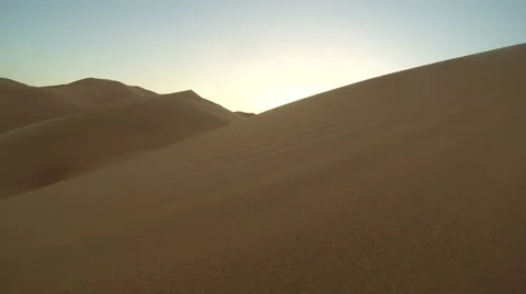 Desert, sand blowing in wind, sunset Video stock 44104619