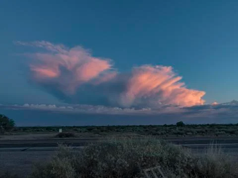 Desert storm cloud pack looks like Sydney Australia music hall Stock Photos