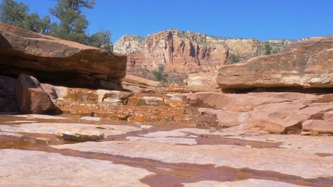 Desert Stream Cuts Through the Red Rocks of Sedona Arizona Stock Footage 80394366