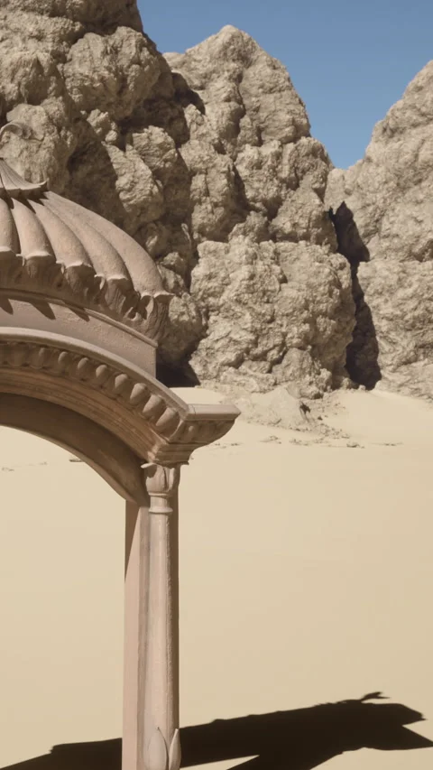 Desert structure stands near large rocky formations under clear sky Video stock 339406771