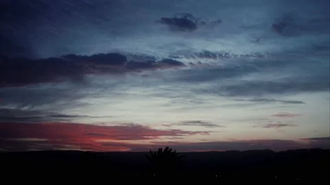 Desert Sunrise in a cloudy sky Time lapse 4k Stock Footage 163680971