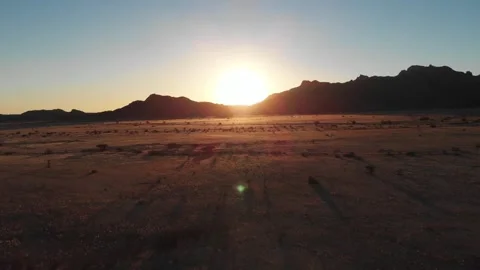 Desert Sunset Over Mountain Range Aerial View Stock Footage 327103619