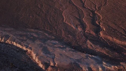 Desert terrain during sunset flyover Stock Footage 81574910