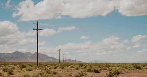 Desert Time Lapse with Moving Clouds over Power Lines Stock Footage 108628168
