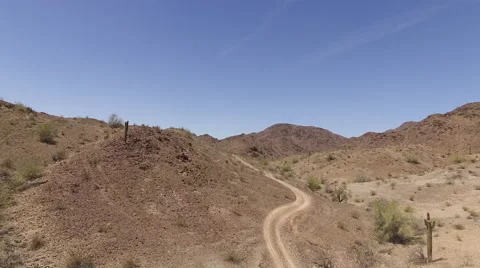 DESERT TRAIL REVERSE PULL 4K Stock Footage 63214252