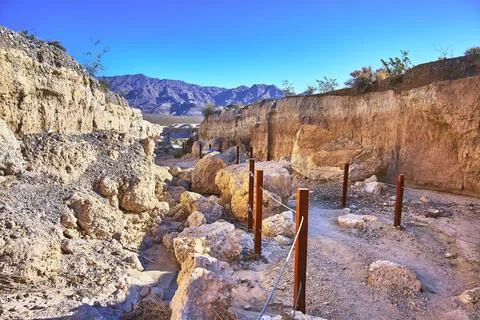 Desert Trail Through Eroded Rock Formations and Mountains at Ice Age Fossil.. Stock Photos